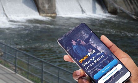 Person holding a phone with Goosechase app open